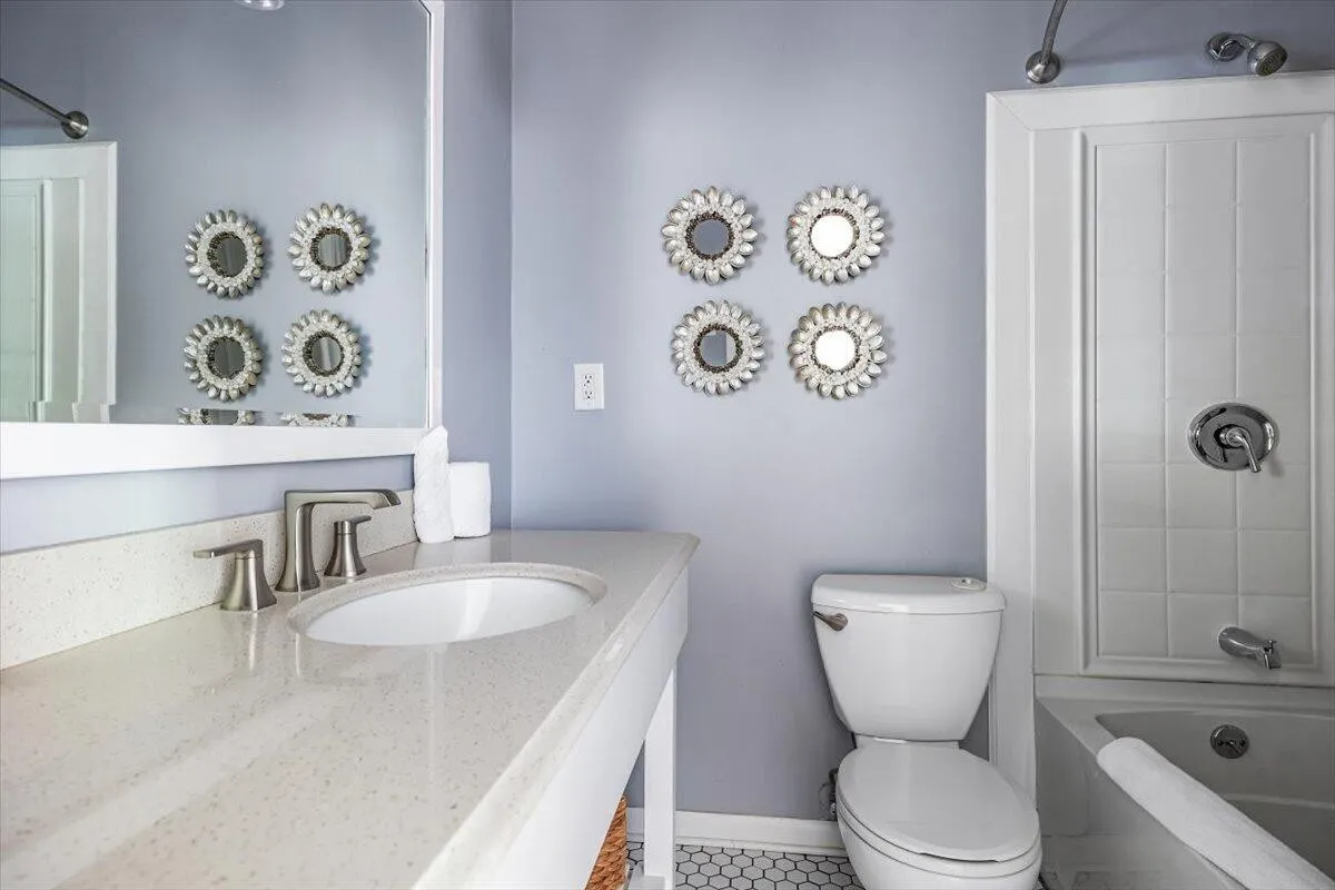 Bathroom with Purple Walls & Decorative Mirrors