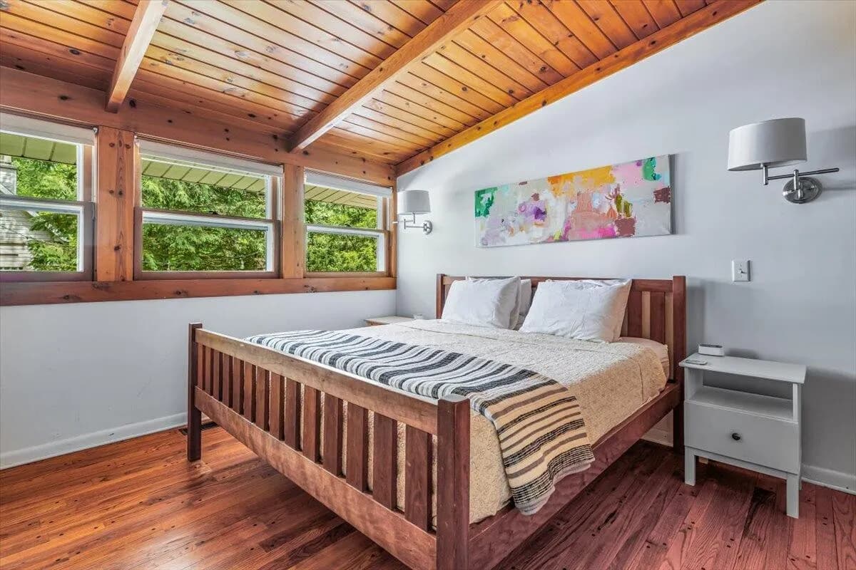Bedroom with Colorful Abstract Art & Wood Ceiling