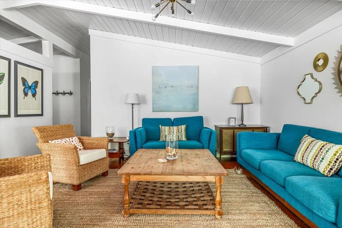 Living Room with Blue Furniture & Butterfly Art