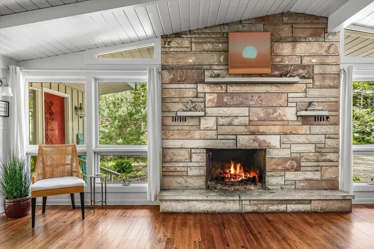 Living Room with Stone Fireplace & Modern Art