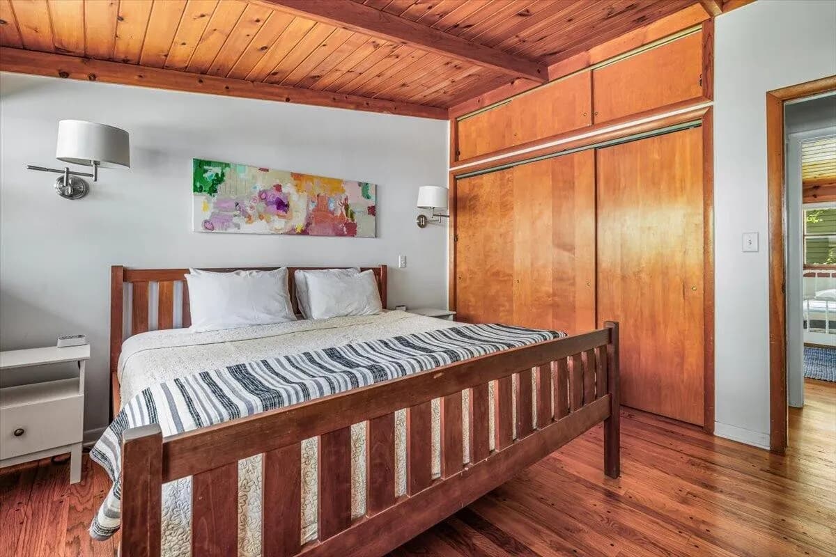 Master Bedroom with Abstract Art & Wood Closets