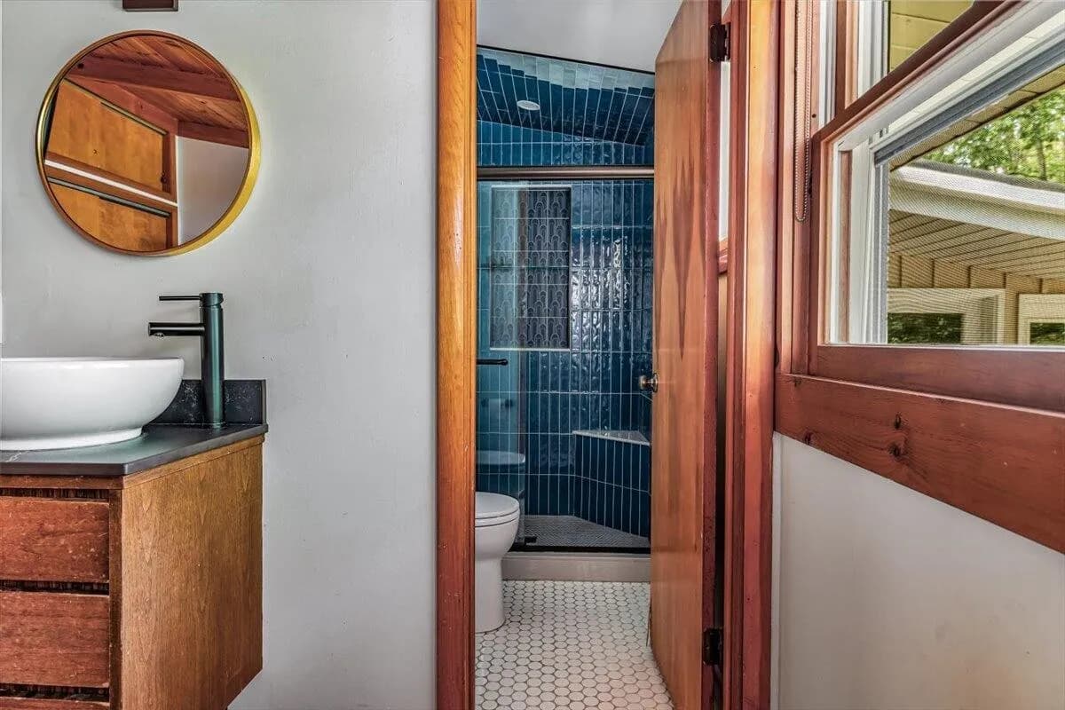 Modern Bathroom with Wood Vanity & Blue Tile Shower
