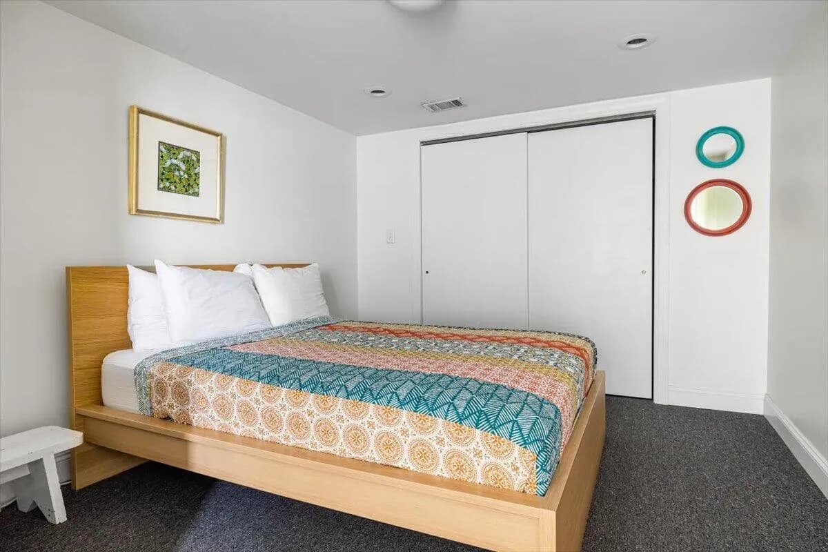 Modern Bedroom with Colorful Bedding & Circular Wall Art