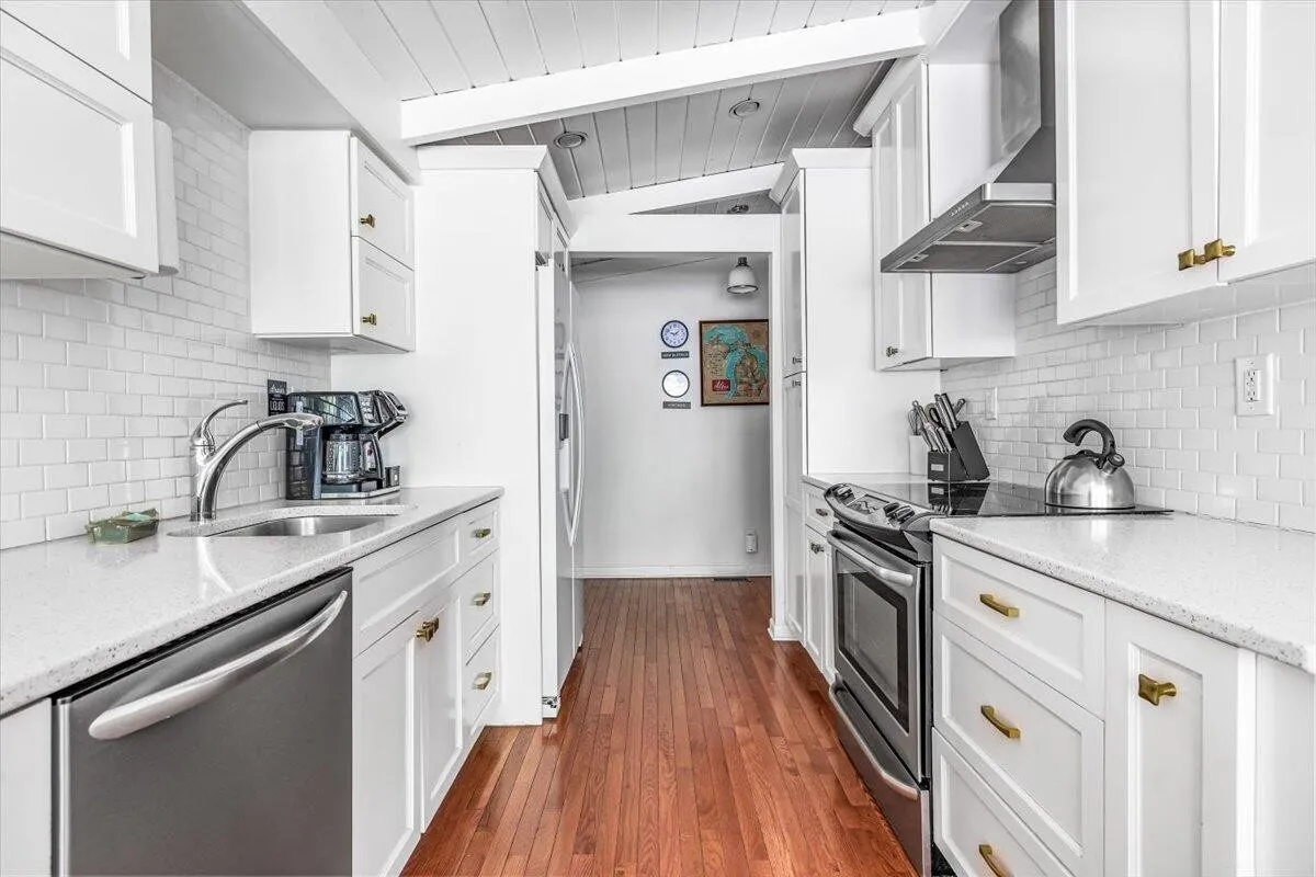 Modern Galley Kitchen with White Cabinets