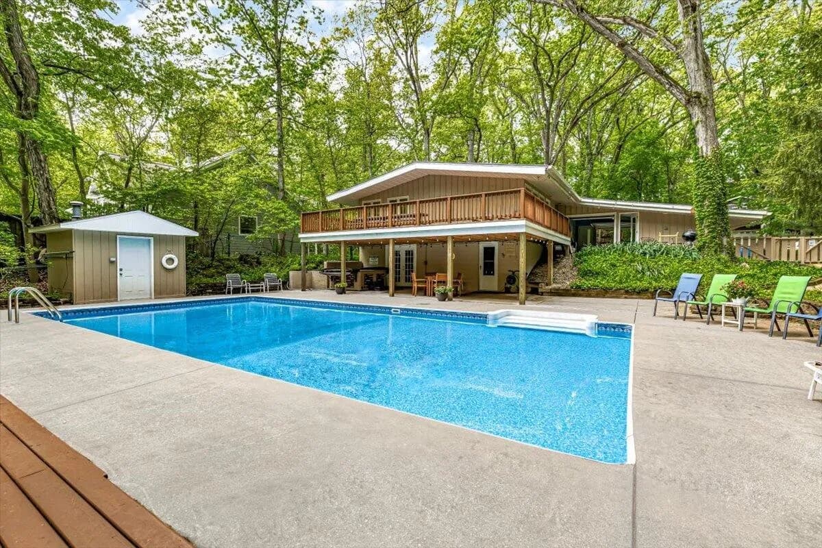 Swimming Pool with Concrete Decking & Lounge Chairs